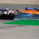 PORTIMAO, PORTUGAL - OCTOBER 25: Lance Stroll of Canada driving the (18) Racing Point RP20 Mercedes clashes with Lando Norris of Great Britain driving the (4) McLaren F1 Team MCL35 Renault during the F1 Grand Prix of Portugal at Autodromo Internacional do Algarve on October 25, 2020 in Portimao, Portugal. (Photo by Jorge Guerrero - Pool/Getty Images)
