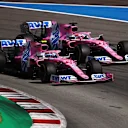 BARCELONA, SPAIN - AUGUST 16: Lance Stroll of Canada driving the (18) Racing Point RP20 Mercedes and Sergio Perez of Mexico driving the (11) Racing Point RP20 Mercedes battle for position during the F1 Grand Prix of Spain at Circuit de Barcelona-Catalunya on August 16, 2020 in Barcelona, Spain. (Photo by Bryn Lennon/Getty Images)