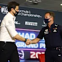 ABU DHABI, UNITED ARAB EMIRATES - DECEMBER 10: Mercedes GP Executive Director Toto Wolff and Red Bull Racing Team Principal Christian Horner shake hands in the team principals press conference ahead of the F1 Grand Prix of Abu Dhabi at Yas Marina Circuit on December 10, 2021 in Abu Dhabi, United Arab Emirates. (Photo by Bryn Lennon/Getty Images)