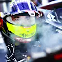 ABU DHABI, UNITED ARAB EMIRATES - DECEMBER 10: Sergio Perez of Mexico and Red Bull Racing prepares to drive in the garage during practice ahead of the F1 Grand Prix of Abu Dhabi at Yas Marina Circuit on December 10, 2021 in Abu Dhabi, United Arab Emirates. (Photo by Mark Thompson/Getty Images)
