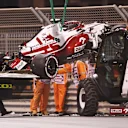 ABU DHABI, UNITED ARAB EMIRATES - DECEMBER 10: The car of Kimi Raikkonen of Finland and Alfa Romeo Racing is removed from the circuit after crashing during practice ahead of the F1 Grand Prix of Abu Dhabi at Yas Marina Circuit on December 10, 2021 in Abu Dhabi, United Arab Emirates. (Photo by Lars Baron/Getty Images)