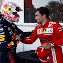 BAKU, AZERBAIJAN - JUNE 05: Third placed qualifier Max Verstappen of Netherlands and Red Bull Racing shakes hands with pole position qualifier Charles Leclerc of Monaco and Ferrari in parc ferme during qualifying ahead of the F1 Grand Prix of Azerbaijan at Baku City Circuit on June 05, 2021 in Baku, Azerbaijan. (Photo by Maxim Shemetov - Pool/Getty Images)