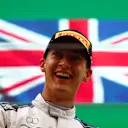 SPA, BELGIUM - AUGUST 29: Second placed George Russell of Great Britain and Williams celebrates on the podium during the F1 Grand Prix of Belgium at Circuit de Spa-Francorchamps on August 29, 2021 in Spa, Belgium. (Photo by Dan Istitene - Formula 1/Formula 1 via Getty Images)