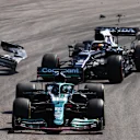 SAO PAULO, BRAZIL - NOVEMBER 14: Yuki Tsunoda of Japan driving the (22) Scuderia AlphaTauri AT02 Honda collides with Lance Stroll of Canada driving the (18) Aston Martin AMR21 Mercedes during the F1 Grand Prix of Brazil at Autodromo Jose Carlos Pace on November 14, 2021 in Sao Paulo, Brazil. (Photo by Bryn Lennon - Formula 1/Formula 1 via Getty Images)