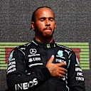 NORTHAMPTON, ENGLAND - JULY 18: Race winner Lewis Hamilton of Great Britain and Mercedes GP celebrates on the podium during the F1 Grand Prix of Great Britain at Silverstone on July 18, 2021 in Northampton, England. (Photo by Dan Istitene - Formula 1/Formula 1 via Getty Images)