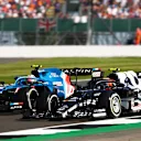 NORTHAMPTON, ENGLAND - JULY 18: Pierre Gasly of France driving the (10) Scuderia AlphaTauri AT02 Honda and Esteban Ocon of France driving the (31) Alpine A521 Renault battle for position during the F1 Grand Prix of Great Britain at Silverstone on July 18, 2021 in Northampton, England. (Photo by Joe Portlock - Formula 1/Formula 1 via Getty Images)