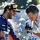 MONZA, ITALY - SEPTEMBER 12: Race winner Daniel Ricciardo of Australia and McLaren F1 and McLaren Chief Executive Officer Zak Brown celebrate on the podium during the F1 Grand Prix of Italy at Autodromo di Monza on September 12, 2021 in Monza, Italy. (Photo by Clive Mason - Formula 1/Formula 1 via Getty Images)