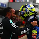SOCHI, RUSSIA - SEPTEMBER 26: Race winner Lewis Hamilton of Great Britain and Mercedes GP hugs Lando Norris of Great Britain and McLaren F1 in parc ferme during the F1 Grand Prix of Russia at Sochi Autodrom on September 26, 2021 in Sochi, Russia. (Photo by Dan Istitene - Formula 1/Formula 1 via Getty Images)