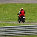 SPIELBERG, AUSTRIA - JULY 10: Carlos Sainz of Spain and Ferrari is driven back to the paddock after retiring from the race during the F1 Grand Prix of Austria at Red Bull Ring on July 10, 2022 in Spielberg, Austria. (Photo by Joe Portlock - Formula 1/Formula 1 via Getty Images)