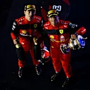 BAHRAIN, BAHRAIN - MARCH 20: Race winner Charles Leclerc of Monaco and Ferrari and Second placed Carlos Sainz of Spain and Ferrari celebrate on the podium during the F1 Grand Prix of Bahrain at Bahrain International Circuit on March 20, 2022 in Bahrain, Bahrain. (Photo by Mark Thompson/Getty Images)