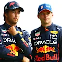 SPA, BELGIUM - AUGUST 27: Pole position qualifier Max Verstappen of the Netherlands and Oracle Red Bull Racing and Third placed qualifier Sergio Perez of Mexico and Oracle Red Bull Racing talk in parc ferme during qualifying ahead of the F1 Grand Prix of Belgium at Circuit de Spa-Francorchamps on August 27, 2022 in Spa, Belgium. (Photo by Dan Istitene - Formula 1/Formula 1 via Getty Images)