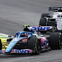 SAO PAULO, BRAZIL - NOVEMBER 13: Esteban Ocon of France driving the (31) Alpine F1 A522 Renault leads Pierre Gasly of France driving the (10) Scuderia AlphaTauri AT03 during the F1 Grand Prix of Brazil at Autodromo Jose Carlos Pace on November 13, 2022 in Sao Paulo, Brazil. (Photo by Bryn Lennon - Formula 1/Formula 1 via Getty Images)