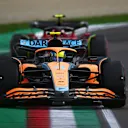 IMOLA, ITALY - APRIL 23: Lando Norris of Great Britain driving the (4) McLaren MCL36 Mercedes leads Carlos Sainz of Spain driving (55) the Ferrari F1-75 during Sprint ahead of the F1 Grand Prix of Emilia Romagna at Autodromo Enzo e Dino Ferrari on April 23, 2022 in Imola, Italy. (Photo by Clive Mason/Getty Images)