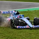 IMOLA, ITALY - APRIL 24: Fernando Alonso of Spain driving the (14) Alpine F1 A522 Renault runs wide during the F1 Grand Prix of Emilia Romagna at Autodromo Enzo e Dino Ferrari on April 24, 2022 in Imola, Italy. (Photo by Clive Mason/Getty Images)