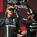 LE CASTELLET, FRANCE - JULY 24: Second placed Lewis Hamilton of Great Britain and Mercedes and Third placed George Russell of Great Britain and Mercedes celebrate on the podium during the F1 Grand Prix of France at Circuit Paul Ricard on July 24, 2022 in Le Castellet, France. (Photo by Dan Mullan/Getty Images)
