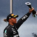 BUDAPEST, HUNGARY - JULY 31: Second placed Lewis Hamilton of Great Britain and Mercedes celebrates on the podium during the F1 Grand Prix of Hungary at Hungaroring on July 31, 2022 in Budapest, Hungary. (Photo by Bryn Lennon - Formula 1/Formula 1 via Getty Images)