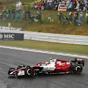 SUZUKA, JAPAN - OCTOBER 09: Zhou Guanyu of China driving the (24) Alfa Romeo F1 C42 Ferrari spins during the F1 Grand Prix of Japan at Suzuka International Racing Course on October 09, 2022 in Suzuka, Japan. (Photo by Bryn Lennon - Formula 1/Formula 1 via Getty Images)