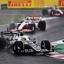 SUZUKA, JAPAN - OCTOBER 09: Yuki Tsunoda of Japan driving the (22) Scuderia AlphaTauri AT03 leads Mick Schumacher of Germany driving the (47) Haas F1 VF-22 Ferrari during the F1 Grand Prix of Japan at Suzuka International Racing Course on October 09, 2022 in Suzuka, Japan. (Photo by Clive Mason/Getty Images)