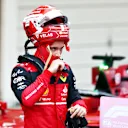 SUZUKA, JAPAN - OCTOBER 09: Third placed Charles Leclerc of Monaco and Ferrari looks on in parc ferme during the F1 Grand Prix of Japan at Suzuka International Racing Course on October 09, 2022 in Suzuka, Japan. (Photo by Clive Rose/Getty Images)