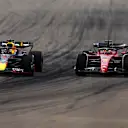 MIAMI, FLORIDA - MAY 08: Max Verstappen of the Netherlands driving the (1) Oracle Red Bull Racing RB18 and Charles Leclerc of Monaco driving (16) the Ferrari F1-75 compete for position on track during the F1 Grand Prix of Miami at the Miami International Autodrome on May 08, 2022 in Miami, Florida. (Photo by Mark Thompson/Getty Images)