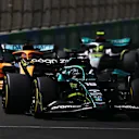 JEDDAH, SAUDI ARABIA - MARCH 27: Lance Stroll of Canada driving the (18) Aston Martin AMR22 Mercedes leads Daniel Ricciardo of Australia driving the (3) McLaren MCL36 Mercedes  during the F1 Grand Prix of Saudi Arabia at the Jeddah Corniche Circuit on March 27, 2022 in Jeddah, Saudi Arabia. (Photo by Joe Portlock - Formula 1/Formula 1 via Getty Images)