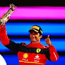JEDDAH, SAUDI ARABIA - MARCH 27: Third placed Carlos Sainz of Spain and Ferrari celebrates on the podium during the F1 Grand Prix of Saudi Arabia at the Jeddah Corniche Circuit on March 27, 2022 in Jeddah, Saudi Arabia. (Photo by Mark Thompson/Getty Images)