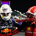 JEDDAH, SAUDI ARABIA - MARCH 27: Race winner Max Verstappen of the Netherlands and Oracle Red Bull Racing and Second placed Charles Leclerc of Monaco and Ferrari talk in parc ferme during the F1 Grand Prix of Saudi Arabia at the Jeddah Corniche Circuit on March 27, 2022 in Jeddah, Saudi Arabia. (Photo by Mark Thompson/Getty Images)