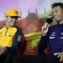 BARCELONA, SPAIN - MAY 20: Alexander Albon of Thailand and Williams and Lando Norris of Great Britain and McLaren laugh in the Drivers Press Conference prior to practice ahead of the F1 Grand Prix of Spain at Circuit de Barcelona-Catalunya on May 20, 2022 in Barcelona, Spain. (Photo by Bryn Lennon/Getty Images)