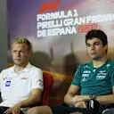 BARCELONA, SPAIN - MAY 20: Lance Stroll of Canada and Aston Martin F1 Team looks on in the Drivers Press Conference next to Kevin Magnussen of Denmark and Haas F1 prior to practice ahead of the F1 Grand Prix of Spain at Circuit de Barcelona-Catalunya on May 20, 2022 in Barcelona, Spain. (Photo by Bryn Lennon/Getty Images)