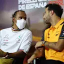 BARCELONA, SPAIN - MAY 20: Lewis Hamilton of Great Britain and Mercedes and Daniel Ricciardo of Australia and McLaren talk in the Drivers Press Conference prior to practice ahead of the F1 Grand Prix of Spain at Circuit de Barcelona-Catalunya on May 20, 2022 in Barcelona, Spain. (Photo by Bryn Lennon/Getty Images)