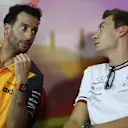 BARCELONA, SPAIN - MAY 20: Daniel Ricciardo of Australia and McLaren talks with George Russell of Great Britain and Mercedes in the Drivers Press Conference prior to practice ahead of the F1 Grand Prix of Spain at Circuit de Barcelona-Catalunya on May 20, 2022 in Barcelona, Spain. (Photo by Bryn Lennon/Getty Images)