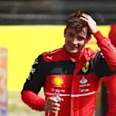 BARCELONA, SPAIN - MAY 21: Pole position qualifier Charles Leclerc of Monaco and Ferrari smiles in parc ferme during qualifying ahead of the F1 Grand Prix of Spain at Circuit de Barcelona-Catalunya on May 21, 2022 in Barcelona, Spain. (Photo by Mark Thompson/Getty Images)