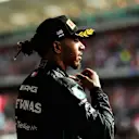 AUSTIN, TEXAS - OCTOBER 23: Second placed Lewis Hamilton of Great Britain and Mercedes celebrates on the podium following the F1 Grand Prix of USA at Circuit of The Americas on October 23, 2022 in Austin, Texas. (Photo by Mario Renzi - Formula 1/Formula 1 via Getty Images)