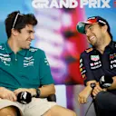 AUSTIN, TEXAS - OCTOBER 20: Lance Stroll of Canada and Aston Martin F1 Team and Sergio Perez of Mexico and Oracle Red Bull Racing talk in the Drivers Press Conference during previews ahead of the F1 Grand Prix of USA at Circuit of The Americas on October 20, 2022 in Austin, Texas. (Photo by Jared C. Tilton/Getty Images)