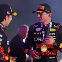 BAHRAIN, BAHRAIN - MARCH 05: Race winner Max Verstappen of the Netherlands and Oracle Red Bull Racing and Second placed Sergio Perez of Mexico and Oracle Red Bull Racing celebrate on the podium during the F1 Grand Prix of Bahrain at Bahrain International Circuit on March 05, 2023 in Bahrain, Bahrain. (Photo by Dan Istitene - Formula 1/Formula 1 via Getty Images)