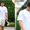 Lance Stroll sporting a wardrobe staple for the drivers - a white tee