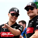 BAKU, AZERBAIJAN - APRIL 30: Zhou Guanyu of China and Alfa Romeo F1 talks with Valtteri Bottas of Finland and Alfa Romeo F1 in the Paddock prior to the F1 Grand Prix of Azerbaijan at Baku City Circuit on April 30, 2023 in Baku, Azerbaijan. (Photo by Rudy Carezzevoli/Getty Images)
