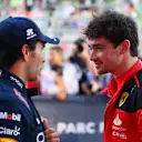 BAKU, AZERBAIJAN - APRIL 28: Pole position qualifier Charles Leclerc of Monaco and Ferrari talks with Third placed qualifier Sergio Perez of Mexico and Oracle Red Bull Racing in parc ferme during qualifying ahead of the F1 Grand Prix of Azerbaijan at Baku City Circuit on April 28, 2023 in Baku, Azerbaijan. (Photo by Dan Mullan - Formula 1/Formula 1 via Getty Images)