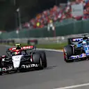 SPA, BELGIUM - JULY 30: Daniel Ricciardo of Australia driving the (3) Scuderia AlphaTauri AT04 leads Esteban Ocon of France driving the (31) Alpine F1 A523 Renault on track during the F1 Grand Prix of Belgium at Circuit de Spa-Francorchamps on July 30, 2023 in Spa, Belgium. (Photo by Joe Portlock - Formula 1/Formula 1 via Getty Images)