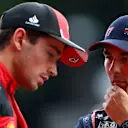SPA, BELGIUM - JULY 28: Third placed qualifier Sergio Perez of Mexico and Oracle Red Bull Racing and Second placed qualifier Charles Leclerc of Monaco and Ferrari talk in parc ferme during qualifying ahead of the F1 Grand Prix of Belgium at Circuit de Spa-Francorchamps on July 28, 2023 in Spa, Belgium. (Photo by Dan Istitene - Formula 1/Formula 1 via Getty Images)