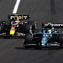 BUDAPEST, HUNGARY - JULY 23: Fernando Alonso of Spain driving the (14) Aston Martin AMR23 Mercedes leads Sergio Perez of Mexico driving the (11) Oracle Red Bull Racing RB19 during the F1 Grand Prix of Hungary at Hungaroring on July 23, 2023 in Budapest, Hungary. (Photo by Mark Thompson/Getty Images)