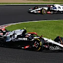 SUZUKA, JAPAN - SEPTEMBER 24: Yuki Tsunoda of Japan driving the (22) Scuderia AlphaTauri AT04 leads Liam Lawson of New Zealand driving the (40) Scuderia AlphaTauri AT04 during the F1 Grand Prix of Japan at Suzuka International Racing Course on September 24, 2023 in Suzuka, Japan. (Photo by Clive Mason/Getty Images)