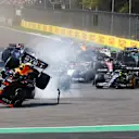 MEXICO CITY, MEXICO - OCTOBER 29: Sergio Perez of Mexico driving the (11) Oracle Red Bull Racing RB19 collides with Charles Leclerc of Monaco driving the (16) Ferrari SF-23 into the first corner at the start of the race during the F1 Grand Prix of Mexico at Autodromo Hermanos Rodriguez on October 29, 2023 in Mexico City, Mexico. (Photo by Mark Thompson/Getty Images)