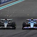 MIAMI, FLORIDA - MAY 07: George Russell of Great Britain driving the (63) Mercedes AMG Petronas F1 Team W14 and Esteban Ocon of France driving the (31) Alpine F1 A523 Renault battle for track position during the F1 Grand Prix of Miami at Miami International Autodrome on May 07, 2023 in Miami, Florida. (Photo by Mark Thompson/Getty Images)