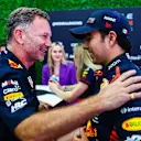 JEDDAH, SAUDI ARABIA - MARCH 18: Red Bull Racing Team Principal Christian Horner talks with Pole position qualifier Sergio Perez of Mexico and Oracle Red Bull Racing in the Paddock after qualifying ahead of the F1 Grand Prix of Saudi Arabia at Jeddah Corniche Circuit on March 18, 2023 in Jeddah, Saudi Arabia. (Photo by Mark Thompson/Getty Images)
