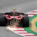 BARCELONA, SPAIN - JUNE 03: Sparks fly behind Carlos Sainz of Spain driving (55) the Ferrari SF-23 on track during qualifying ahead of the F1 Grand Prix of Spain at Circuit de Barcelona-Catalunya on June 03, 2023 in Barcelona, Spain. (Photo by David Ramos/Getty Images)