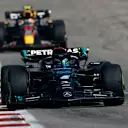 AUSTIN, TEXAS - OCTOBER 22: George Russell of Great Britain driving the (63) Mercedes AMG Petronas F1 Team W14 leads Sergio Perez of Mexico driving the (11) Oracle Red Bull Racing RB19 on track during the F1 Grand Prix of United States at Circuit of The Americas on October 22, 2023 in Austin, Texas. (Photo by Chris Graythen/Getty Images)