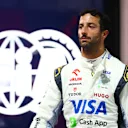 SINGAPORE, SINGAPORE - SEPTEMBER 21: 17th placed qualifier Daniel Ricciardo of Australia and Visa Cash App RB walks in the Pitlane during qualifying ahead of the F1 Grand Prix of Singapore at Marina Bay Street Circuit on September 21, 2024 in Singapore, Singapore. (Photo by Mark Thompson/Getty Images)