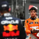 SINGAPORE, SINGAPORE - SEPTEMBER 21: Pole position qualifier Lando Norris of Great Britain and McLaren talks with Second placed qualifier Max Verstappen of the Netherlands and Oracle Red Bull Racing in parc ferme during qualifying ahead of the F1 Grand Prix of Singapore at Marina Bay Street Circuit on September 21, 2024 in Singapore, Singapore. (Photo by Rudy Carezzevoli/Getty Images)
