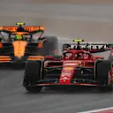 HANGHAI, CHINA - APRIL 19: Carlos Sainz of Spain driving (55) the Ferrari SF-24 leads Lando Norris of Great Britain driving the (4) McLaren MCL38 Mercedes on track during Sprint Qualifying ahead of the F1 Grand Prix of China at Shanghai International Circuit on April 19, 2024 in Shanghai, China. (Photo by Lintao Zhang/Getty Images )